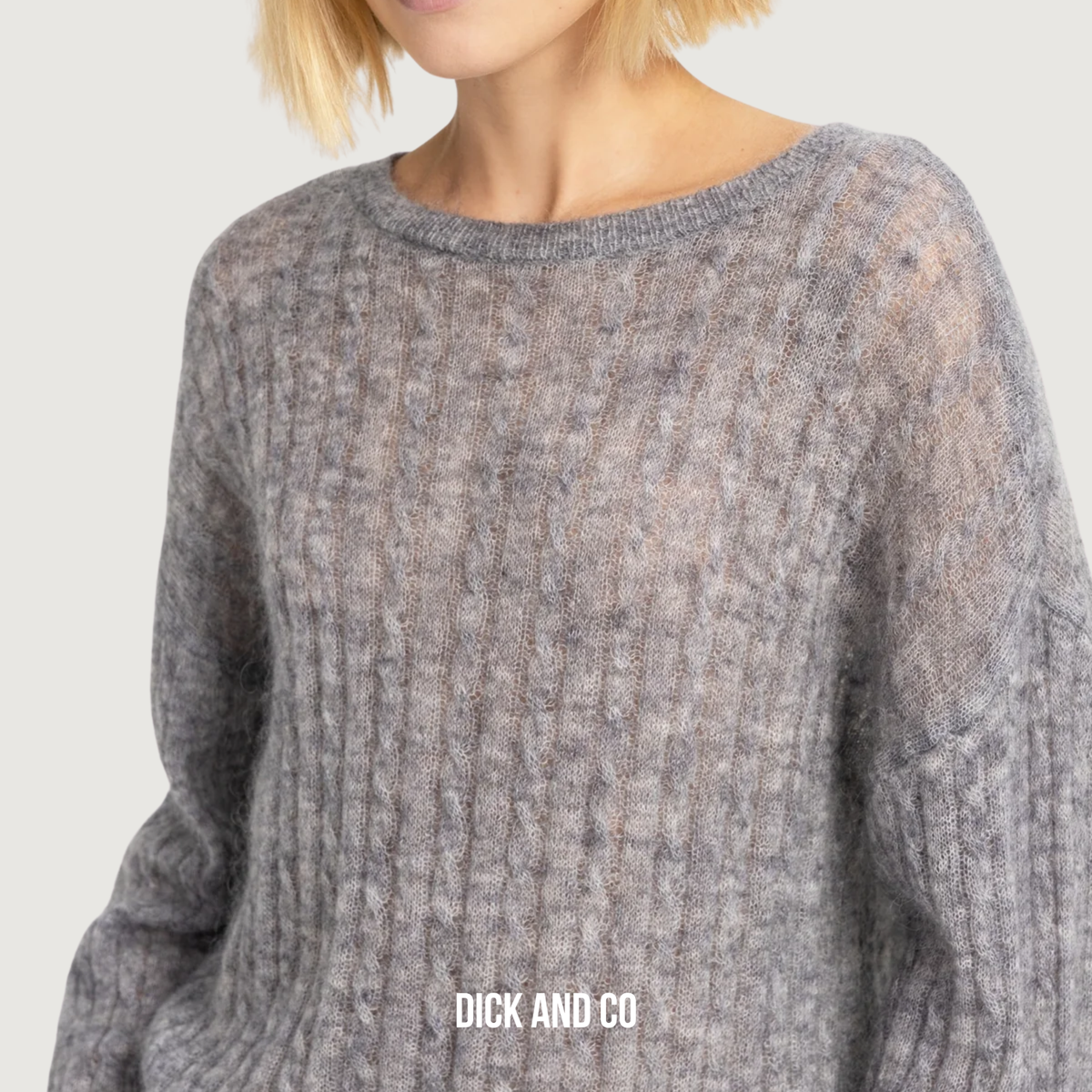 Oversized trui met kabelpatroon en boothals